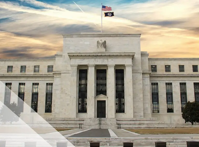 A large, white marble government building with tall columns, an American flag and another flag flying on top, symbolizes national values and cloud compliance, set against a dramatic sunset sky.